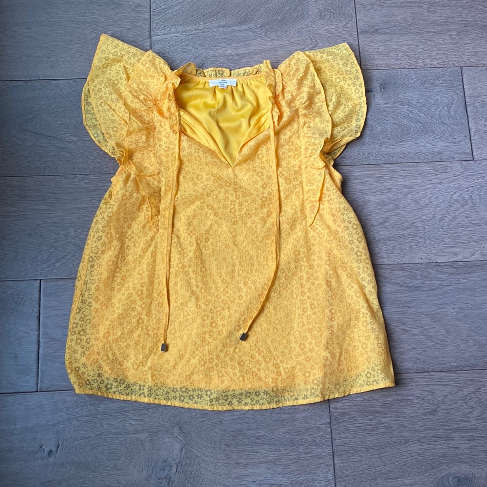 Bright golden colored blouse with flower print